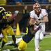 Illinois quarterback Reilly O'Toole is sacked by Michigan defensive end Mario Ojemudia in the second half of the game on Saturday. Michigan won 45-0. Daniel Brenner I AnnArbor.com